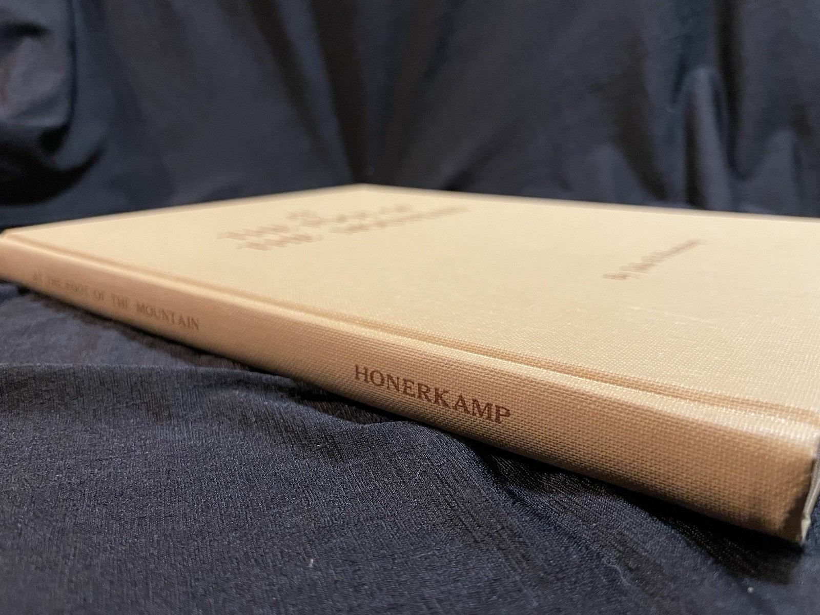 AT THE FOOT OF THE MOUNTAIN by Honerkamp, John R. 1978 Inscribed 1st edition