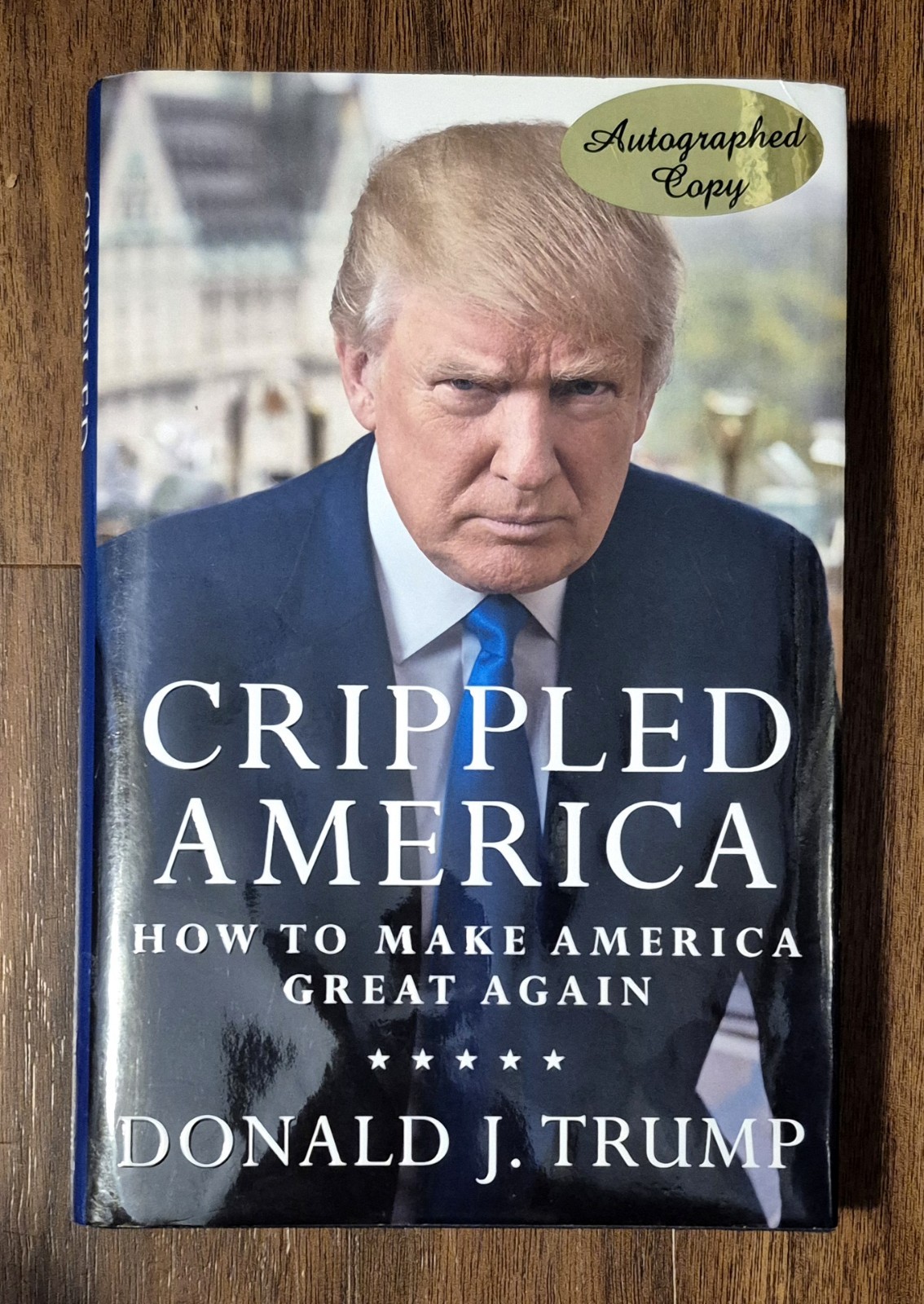 PRESIDENT DONALD TRUMP SIGNED AUTOGRAPHED “CRIPPLED AMERICA” HARDCOVER BOOK